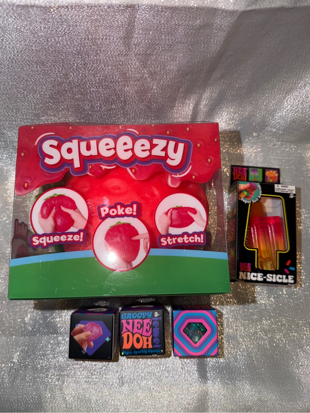 One NeeDoh Nice-Sicle, One NeeDoh Groovy Jewel & One Squishy Strawberry